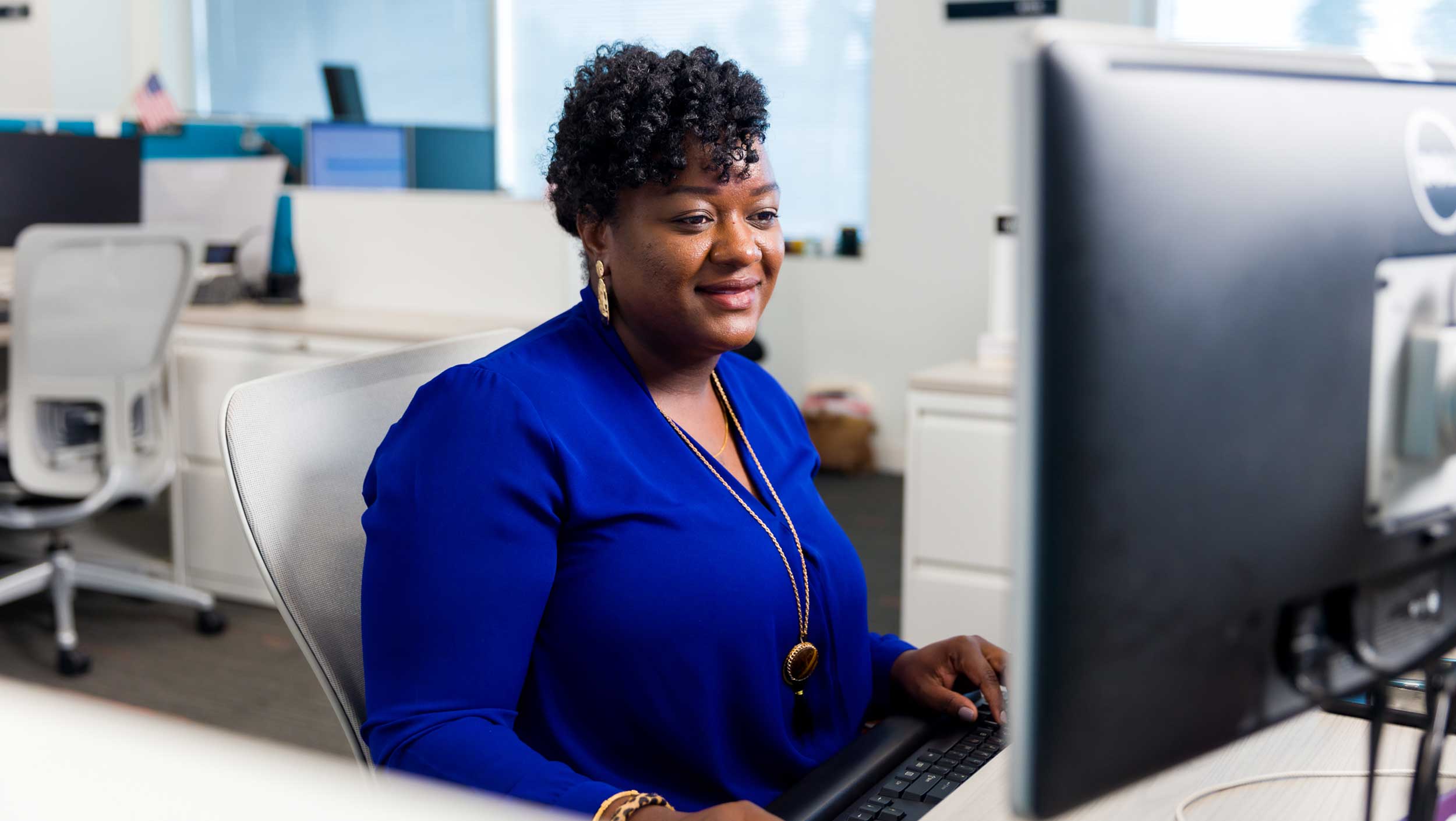 A woman sitting at her work desk in Florida