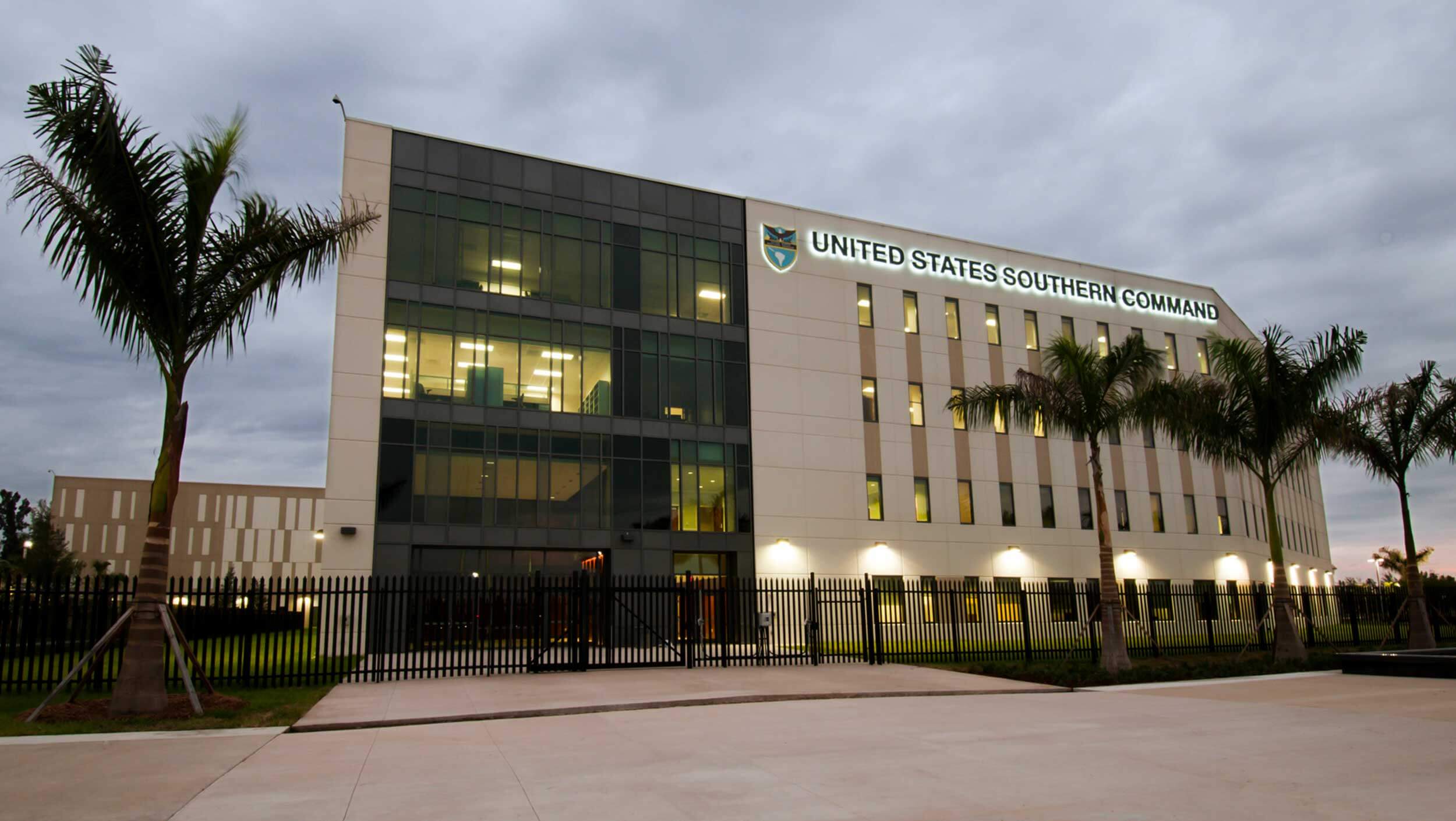 A palm tree in front of a building