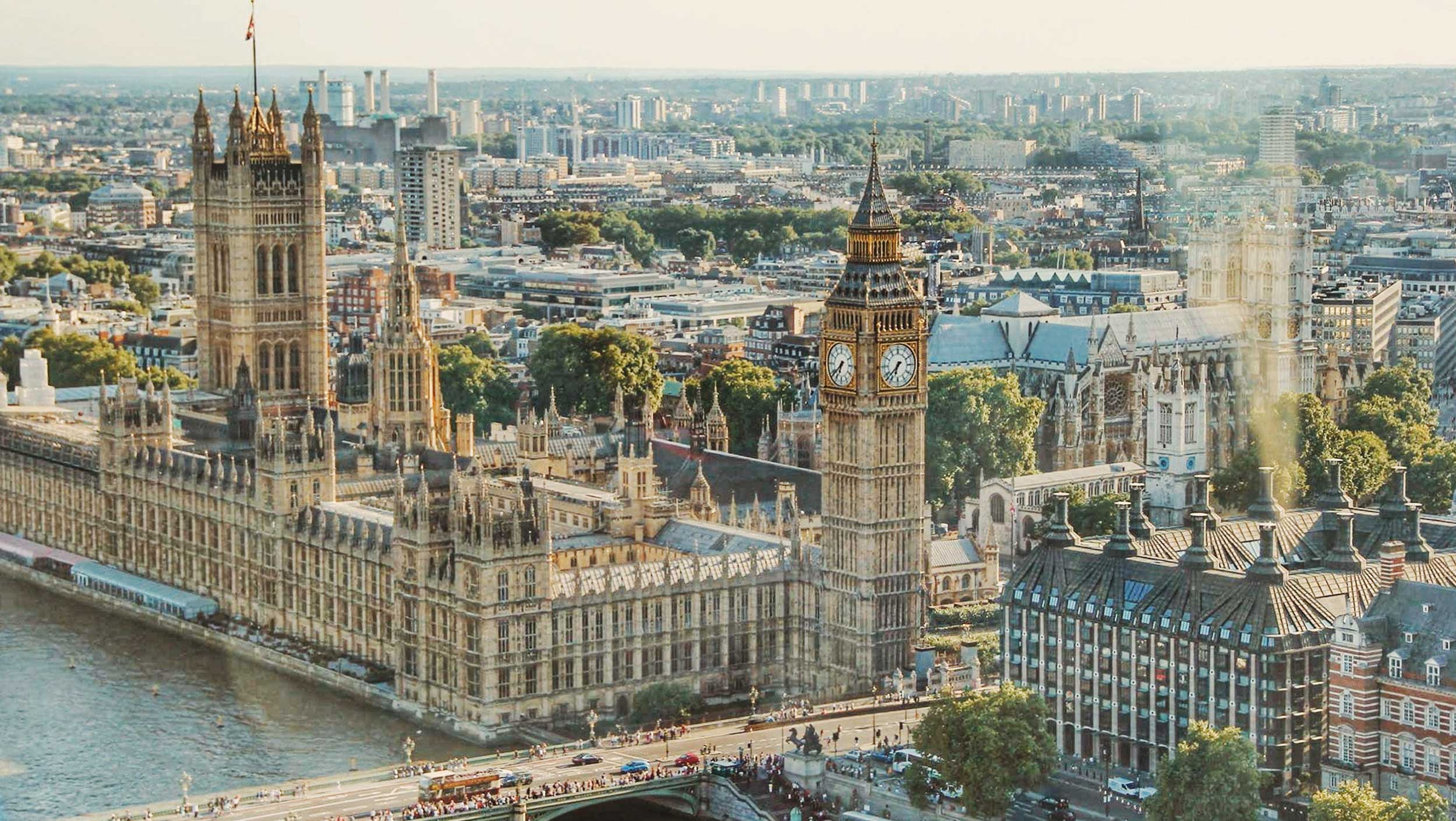 The tower of the city with Palace of Westminster in the background
